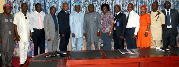 The Vice-Chancellor, Prof. Ganiyu Olatunji Olatunde (Centre in cap) in a group photograph with Prof. Abiodun Salami and other University functionaries.