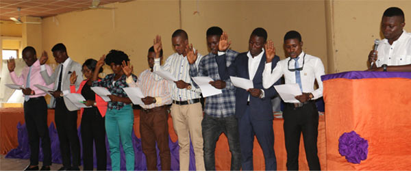 The Students’ Union President, Akinbo Afolabi (Right), administering the oath of office to the other Executive members of the Students Senate