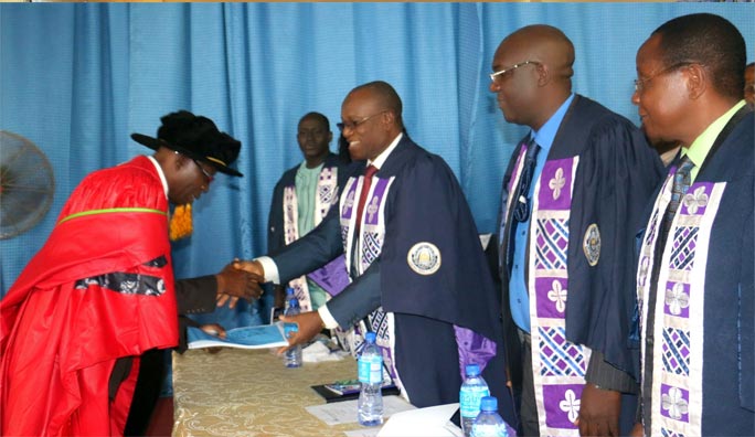 Inaugural Prof.-D.B.-Oke-handing-over-his-Inaugural-Lecture-to-the-Vice-Chancellor,-Prof.-G.O.-Olatunde
